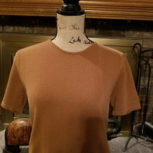 A knit top. It is a bronze color.